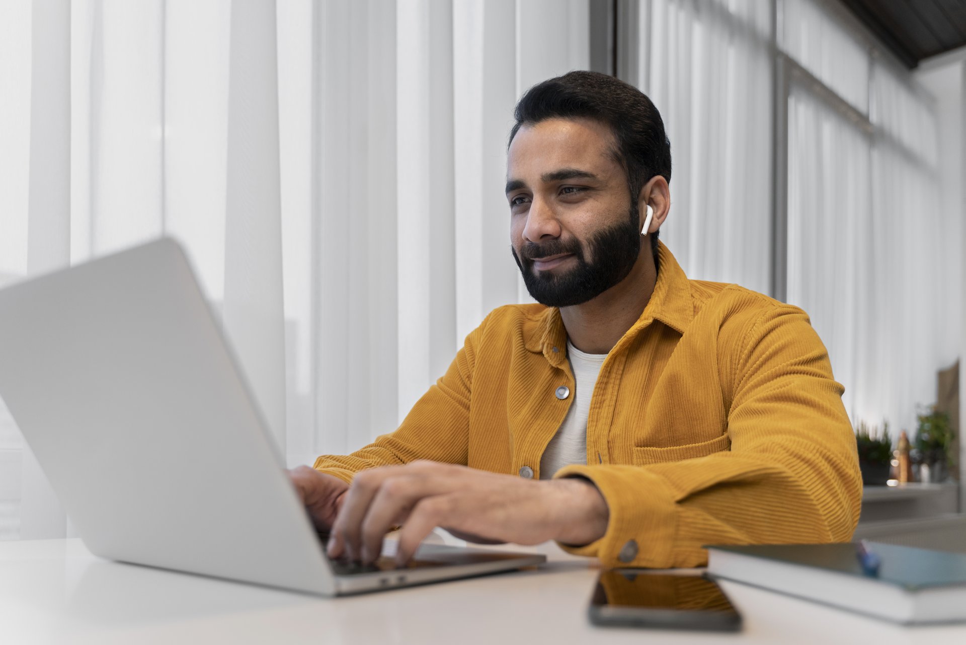 Business owner reviewing work on a laptop